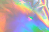 Fototapeta  - abstract holographic iridescent foil texture background with rainbow colored spots