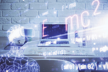 Desktop computer background and formula hologram writing. Double exposure. Education concept.