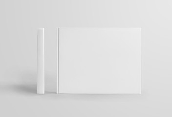 Wall Mural - Set of standing white hardcover books landscape orientation, front and side view, isolated on background.