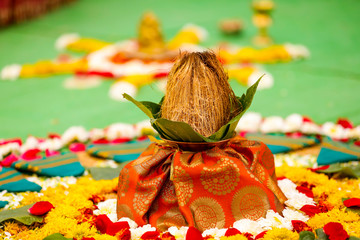Poster - Indian wedding ceremony : decorative coper kalash with green leaf and coconut