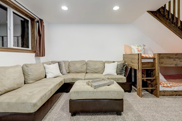 Wall Mural - Living room interior with beige sofa, natural touches, custom build wooden bunk bed, tall ceiling with loft.