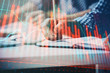 © peshkova - Multi exposure of two men planing investment with stock market forex chart.