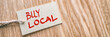 © Maridav - BUY LOCAL label banner natural wooden background. Support small businesses of your community during economic recession by shopping locally in retail stores.