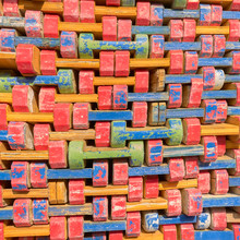 Abstract View Of Colorful Wooden Timber Formwork Beams For Building Constructions, Stacked On A Pile.