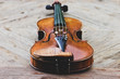 Violin on a wooden background. Strings instrument. Beautiful violin.