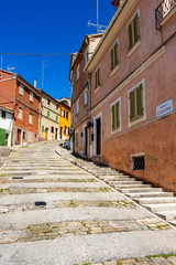 Wall Mural - Beautiful steep Borgo Cascine or Via Giacomo Casanova, G. Casanova Street view outside the old city wall in Castelfidardo, Ancona Province, Marche Region, Italy