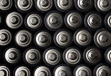 Batteries, Top View, Rows Of Alkaline Battery AA Size Format. Energy Abstract Background