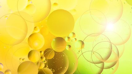 bright oily drops in water with colorful background, close-up