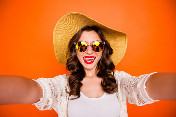 Poster - Photo of brunette cheerful wavy cute nice charming pretty girlfriend taking selfie in eyewear eyeglasses spectacles licking lips isolated vivid orange color background