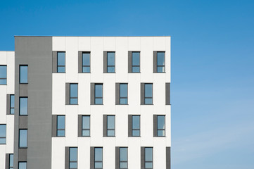 White and grey facade of modern office building