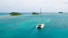 Sailing Yachts At Anchor In The Turquoise Colored Waters Of The San Blas Islands, Kuna Yala, Panama