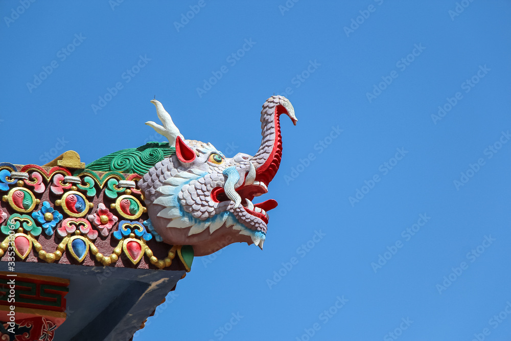 Tengboche Monastery (or Thyangboche Monastery), also known as Dawa Choling Gompa. View of dragon head on the gates of monastery. Religious architecture theme. - obrazy, fototapety, plakaty 