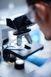 © chokniti - scientist working with microscope in laboratory, medical science research