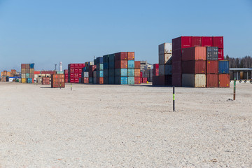 container terminal with sea containers on sky background