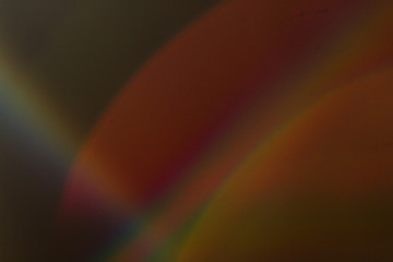 Wall Mural - lens flare and light leak haze texture on a black background.