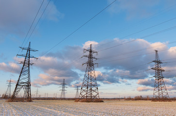 Wall Mural - power lines during a beautiful winter sunset.