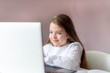 © Любовь Ситникова - Distance learning online education. Stay home. Covid-19 Coronavirus and Learning from home. Sickness school girl studying at home with digital tablet laptop notebook and doing homework.