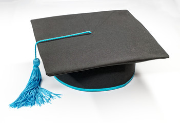 Graduation cap on white background