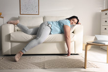 Lazy Overweight Woman Resting On Sofa At Home