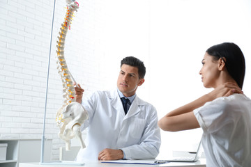 Poster - Young woman visiting orthopedist in medical office