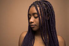 Portrait Of Sensual Young Woman With Long Purple Braids