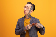 Portrait Of Stylish Young Man With Tattoos