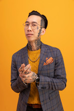 Portrait Of Cool Stylish Young Man With Tattoos