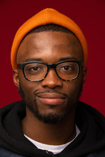 Close Up Portrait Of Smiling Young Man With Eyeglasses And Beanie