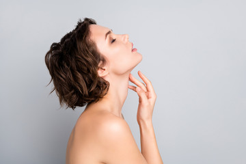 Wall Mural - Closeup profile photo of attractive beautiful naked lady bob short hairstyle sensual aesthetic beauty touch hand arm silky neck skin eyes closed isolated grey color background
