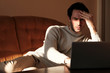 © Teodor Lazarev - One male sitting in the house and doing some job on his laptop and feel frustrated