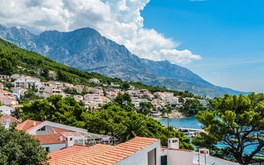 Wall Mural - Aerial view near Punta Rata, small Podrace beach, famous Brela Rock - symbol of Brela. Makarska Riviera, Croatia