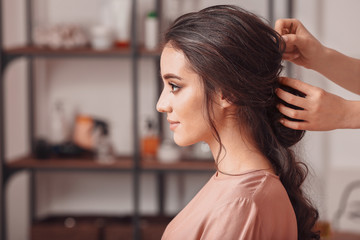 Canvas Print - Hairdresser working with young woman in salon