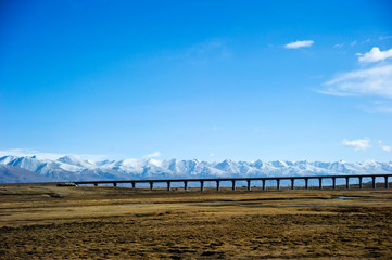 landscape with snow mountain and sky in Tibet