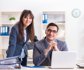 Man and woman working in the office