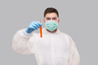 © Alex - Male Laboratory Worker Showing Blood Analysis Wearing Medical Mask, Gloves and Chemical Suit. Virus, Science Concept Portrait