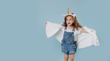 Curly Girl Toddler Plays In A Unicorn Costume