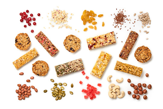 Energy healthy snack. Cereal granola bar with nuts and dry fruit berries. Fitness diet food. Protein muesli bars isolated on white background. Sport oatmeal bar, top view