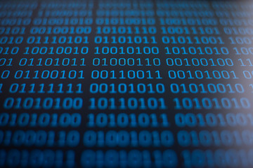 Wall Mural - concept of data, information. binary code on monitor of a computer