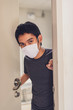 © biwwbbiw - Coronavirus or covid-19. Asian men wearing mask protection, work from home with disinfectant gel.