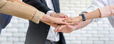 Close up business team of young man and woman showing unity with their hands together , unity success and teamwork concept.