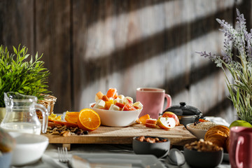 Wall Mural - Breakfast on the table on a beautiful holiday morning with free space for an advertising product