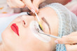 © lester120 - Woman on the procedure for eyelash extensions, eyelashes lamination.