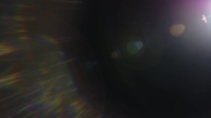 Wall Mural - beautiful abstract defocused lens flare on a dark background. real light leaks and lens flare.