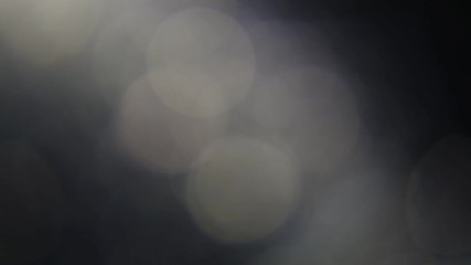 Wall Mural - beautiful abstract defocused lens flare on a dark background. real light leaks and lens flare.