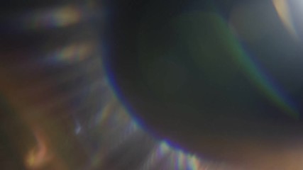 Wall Mural - beautiful abstract defocused lens flare on a dark background. real light leaks and lens flare.