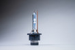New xenon lamp on a gray gradient background. The concept of discharge lamps to replace conventional incandescent lamps