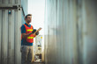 © Nopphon - Foreman holding clipboard working at Container cargo harbor. Business Logistics import export shipping concept.