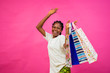 © Courage - young beautiful black happy lady holding some shopping bags