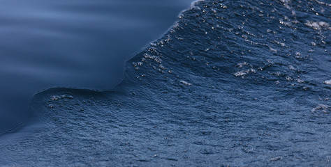 beautiful separation of water into a smooth surface and a storm. Blue Art. Water Banner. Liquid Ice. Icy Pattern. Ocean Texture. Abstract magical blue water. Water Waves Surface as Background