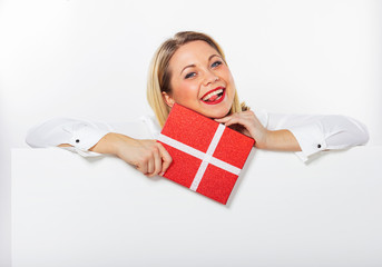 Isolated portrait of a young girl with a gift box in her  hands. Businesswoman with red lips.